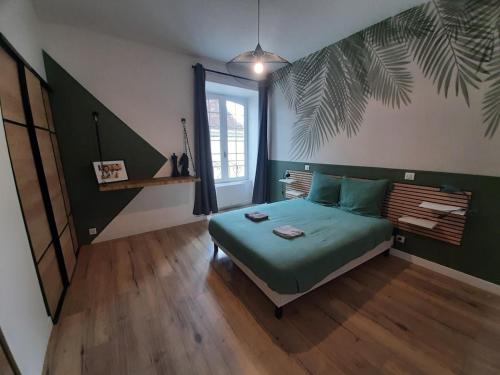 Ένα ή περισσότερα κρεβάτια σε δωμάτιο στο Le canon des remparts