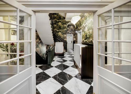 a hallway with a black and white checkered floor at New Town Hotel in Edinburgh