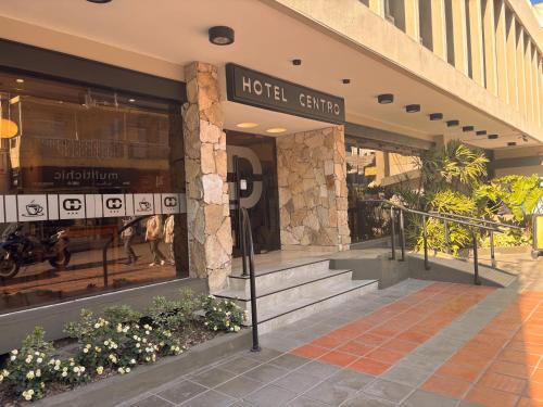 a hotel entrance with stairs in front of a store at Hotel Centro in Santiago del Estero