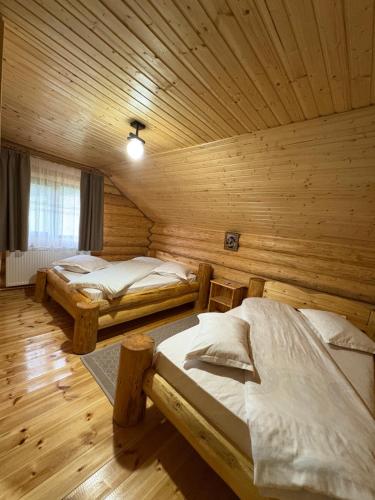Postel nebo postele na pokoji v ubytování Cabana Colț De Munte