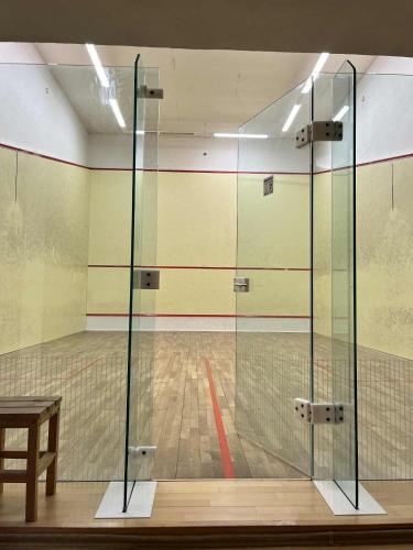 a volleyball court with a glass case in a gym at Penzión Korytnačka in Námestovo