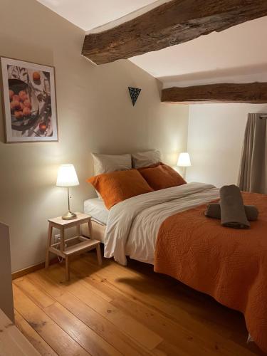 Ένα ή περισσότερα κρεβάτια σε δωμάτιο στο Le Perchoir Provencal