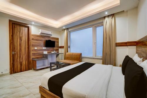 Ένα ή περισσότερα κρεβάτια σε δωμάτιο στο Townhouse Railway Road Katra Formerly The Amro