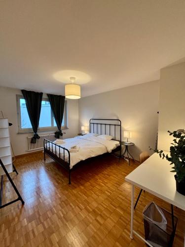 a bedroom with a large bed in a room at Live Zurich in Cozy Apartment in Zürich