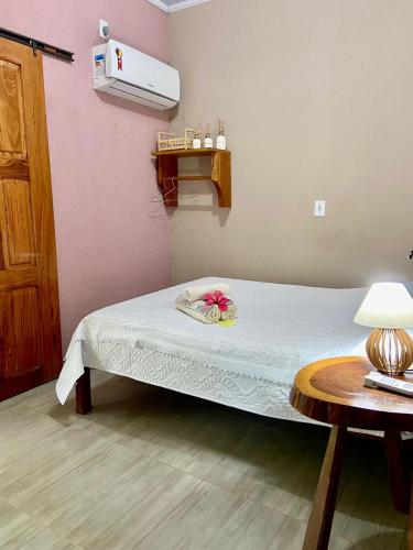 Postel nebo postele na pokoji v ubytování Encanto das Flores