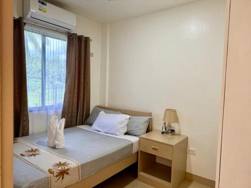 Postel nebo postele na pokoji v ubytování Rose Inn