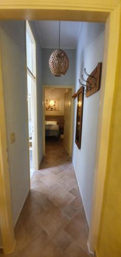 a hallway leading to a room with a bedroom at Appartamento Santa Sofia in Padova