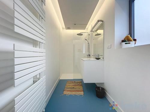 a bathroom with a sink and a mirror at Anavel Atao in Lille