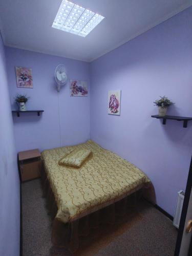 a bedroom with a bed in a room with a window at Двокімнатна квартира біля Сіті-центру in Mykolaiv
