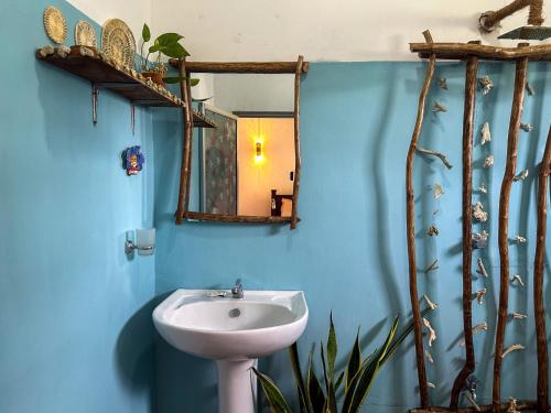 a bathroom with a sink and a mirror at Stay Happy at Chathurni Villa, Ahangama in Ahangama
