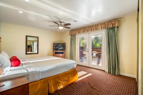 a bedroom with a large bed and a window at Pine-Santa Fe by Roundhouse Resort and Spa in Indian Pine