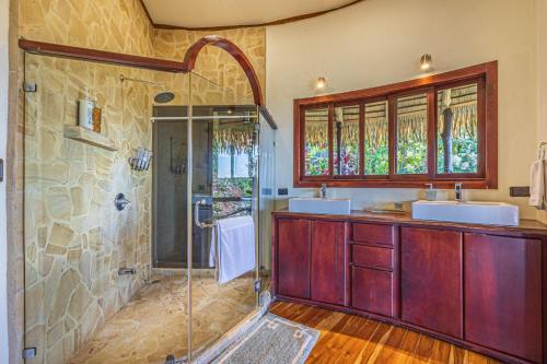 a bathroom with two sinks and a shower at TikiVibez in Coronado