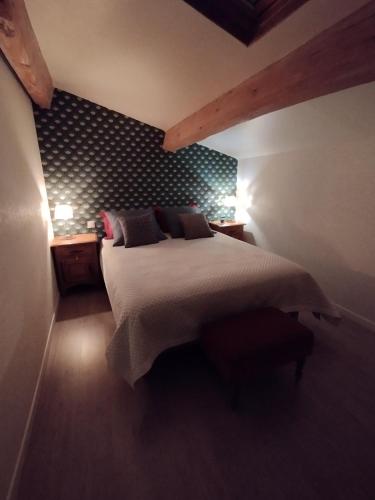 Postel nebo postele na pokoji v ubytování au petit chai