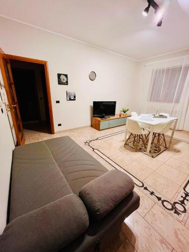 a living room with a couch and a table at House in Cave - Casa Vacanze in Massafra