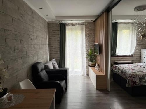 Ένα ή περισσότερα κρεβάτια σε δωμάτιο στο Apartman M&A