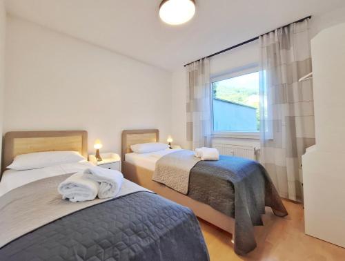 Postel nebo postele na pokoji v ubytování Villa Auszeit im Haus Auszeit im Weindorf 1 BR up to 3 people