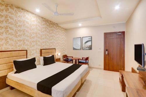 Ένα ή περισσότερα κρεβάτια σε δωμάτιο στο Hotel O GSP Grand