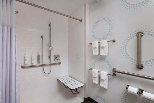 a bathroom with a shower and a toilet at Tru By Hilton Irving Dfw South in Irving