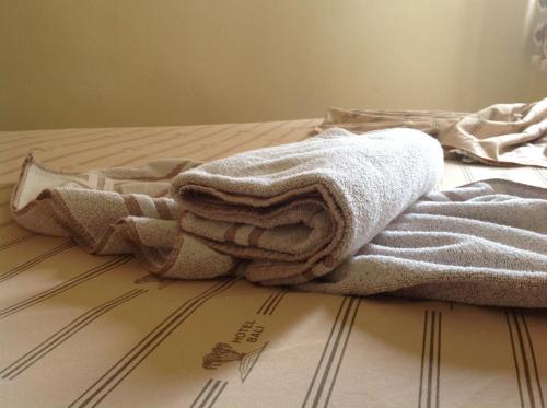 Ένα ή περισσότερα κρεβάτια σε δωμάτιο στο Hotel Bali