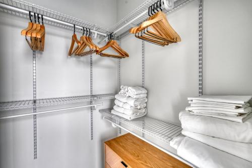 a walk in closet with shelves and towels at Blueground Downtown Austin pool nr Texas State Capitol ATX-238 in Austin