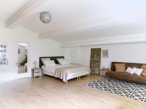 En eller flere senge i et værelse på PLEIN SUD