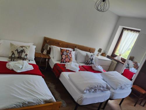 a bedroom with two beds and a couch at Natalia in Sauze d'Oulx