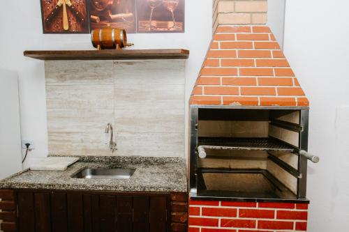 Køkken eller tekøkken på Casa Camburi