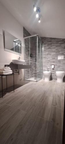 a bathroom with a shower and a sink and a toilet at La rosa rossa in San Gemini