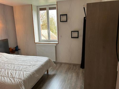 Postel nebo postele na pokoji v ubytování Gite du bourbouillon