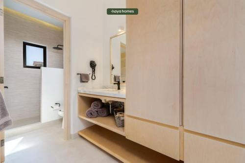 a bathroom with a sink and a shower at Amazing Apt with City View - Rooftop Pool in Los Médanos Partidos