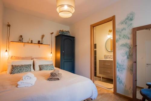 Ένα ή περισσότερα κρεβάτια σε δωμάτιο στο Le Jardin Secret