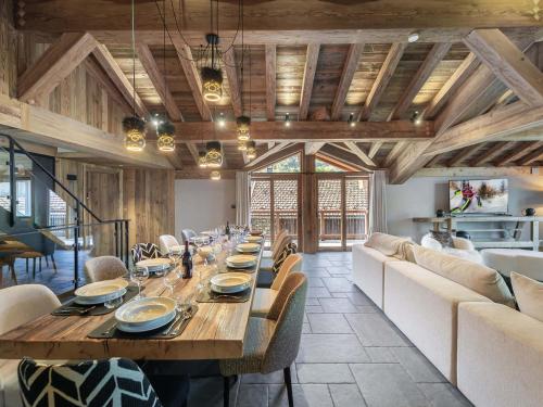a dining room with a long wooden table and chairs at Chalet d'exception avec piscine, spa et hammam - 14 pers., Saint Martin de Belleville - FR-1-570-54 in Saint-Martin-de-Belleville