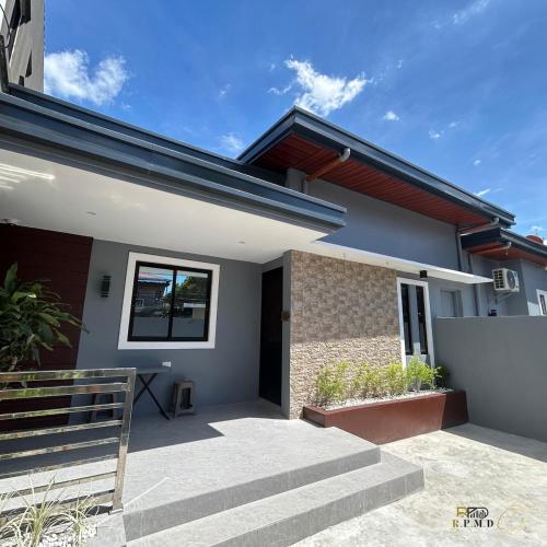 a house with a staircase in front of it at CJ Apartments-III in Olongapo