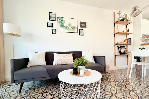 a living room with a couch and a table at SOL Aguadulce in Roquetas de Mar