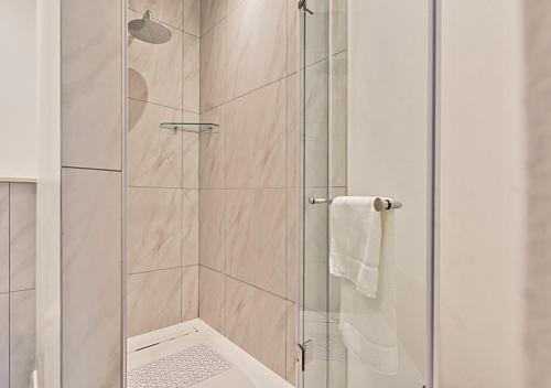 a bathroom with a shower with a glass door at MNM Luxury Suit 424A in Pretoria