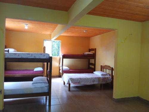 Postel nebo postele na pokoji v ubytování Ecopousada Bacabas - Hotel, Camping e Balneário