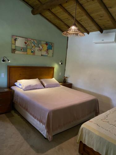 Ένα ή περισσότερα κρεβάτια σε δωμάτιο στο Aldeia Patuá - chalés na Praia de Algodões