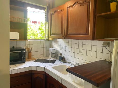 Kuchyň nebo kuchyňský kout v ubytování résidence Pòm kajou