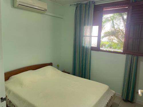 Postel nebo postele na pokoji v ubytování résidence Pòm kajou