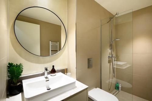 a bathroom with a sink and a mirror at inJoy in Belgrade