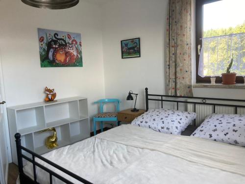 Postel nebo postele na pokoji v ubytování Ferienhaus zur alten Zeder