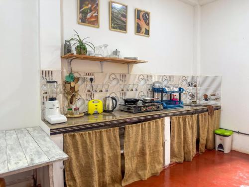 a kitchen with a counter top in a room at Stay Happy at Chathurni Villa, Ahangama in Ahangama