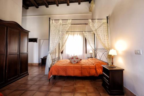 Postel nebo postele na pokoji v ubytování Agriturismo sanacore di sanacore salvatore