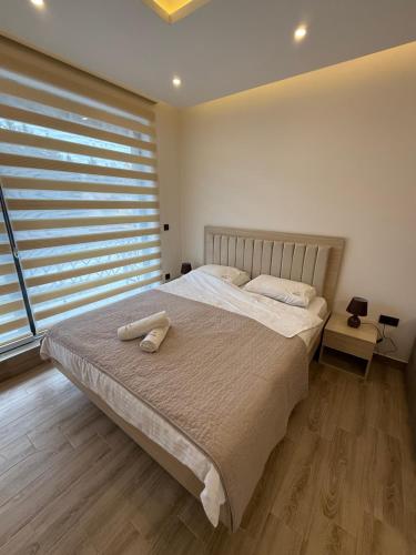 Giường trong phòng chung tại Apartman SEVN