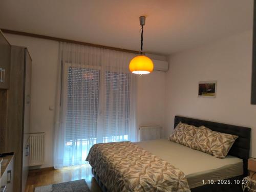 Postel nebo postele na pokoji v ubytování Dunja Doboj