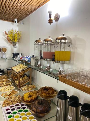 a bakery with many different types of pastries on display at Max Hotel in Brasília