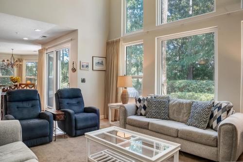 a living room with a couch and two chairs and a table at Turnberry 8573 in Destin