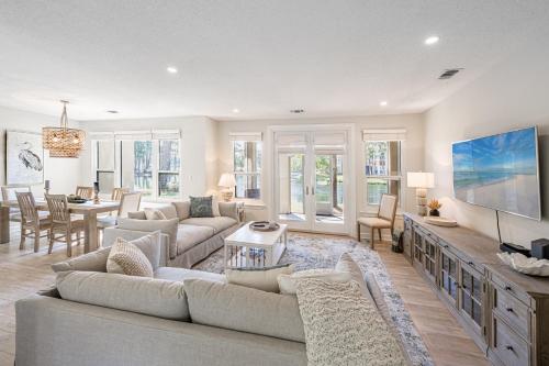 a living room with couches and a dining room at Turnberry 8561 in Destin