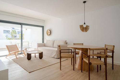 a living room with a couch and a table at Casa Tester by FTV HOLIDAYS HOMES in Villaverde