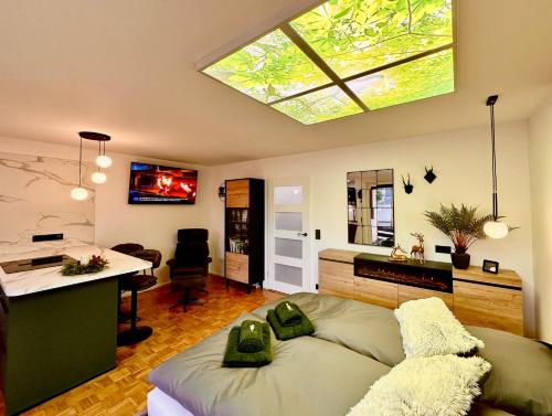 a bedroom with a bed and a desk and a window at Ferienwohnung Harzurlaub II in Hahnenklee-Bockswiese